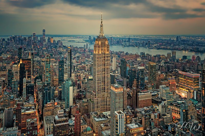 Aerial view of the Empire State Building rising over Manhattan at sunset