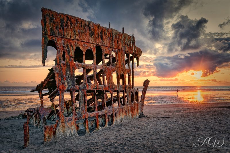 Peter Iredale's wreck on the beach near Warrenton, Oregon at sunset