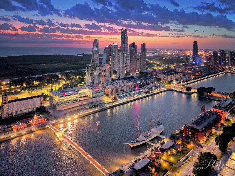 Aerial view of waterfront towers and docks glowing at sunset, Buenos Aires
