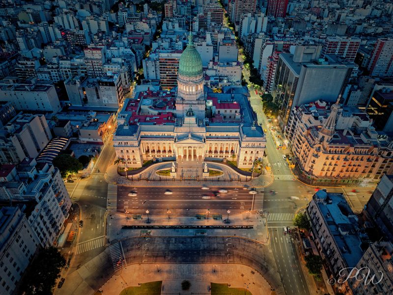 Aerial view of a domed palace facing a long plaza at dusk, Buenos Aires